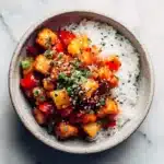 sweet & sour tofu with pineapple in a warm, cozy bowl